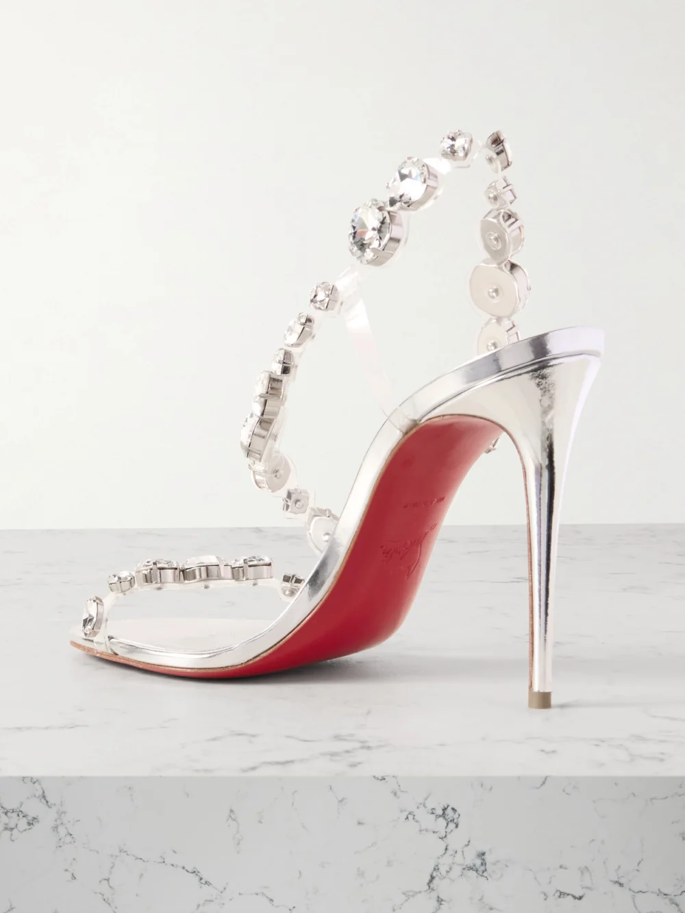 Back view of the Christian Louboutin Rosalie 100 Crystal-embellished Pvc Sandals