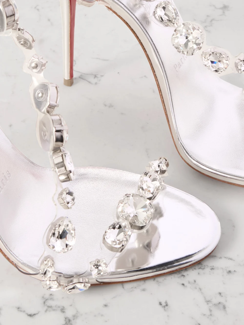 Close-up detail of the Christian Louboutin Rosalie 100 Crystal-embellished Pvc Sandals