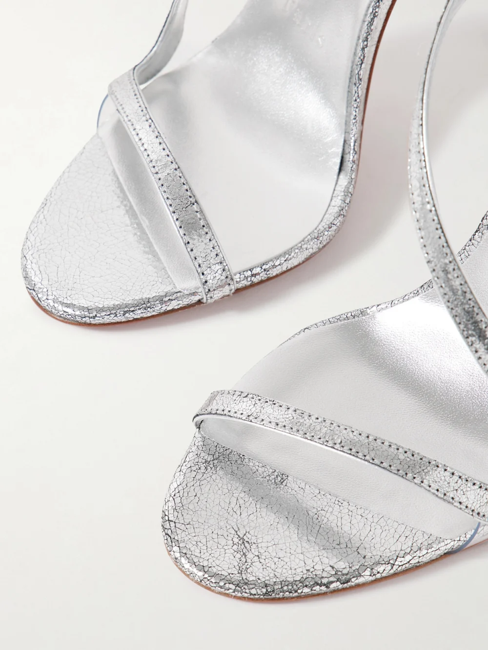 Close-up detail of the Christian Louboutin Rosalie 100 Metallic Cracked-leather Slingback Sandals