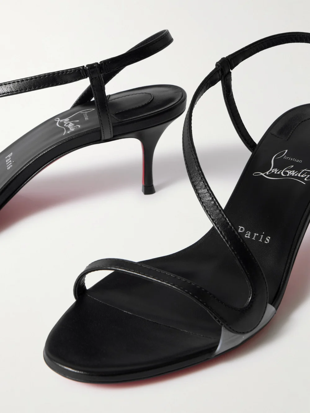Close-up detail of the Christian Louboutin Rosalie 55 Leather and Pvc Slingback Sandals