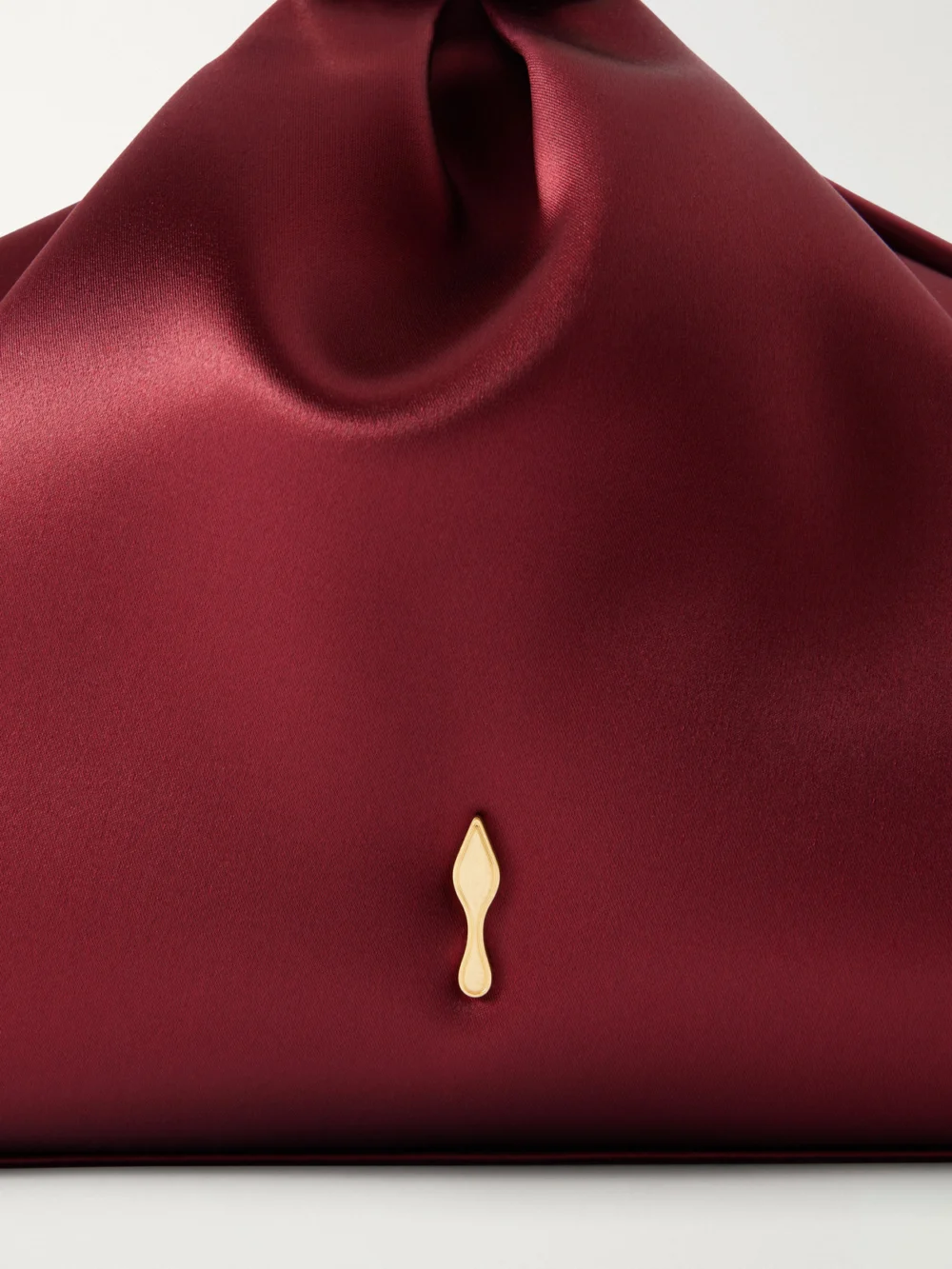 Close-up detail of the Christian Louboutin Sabrina Satin Clutch