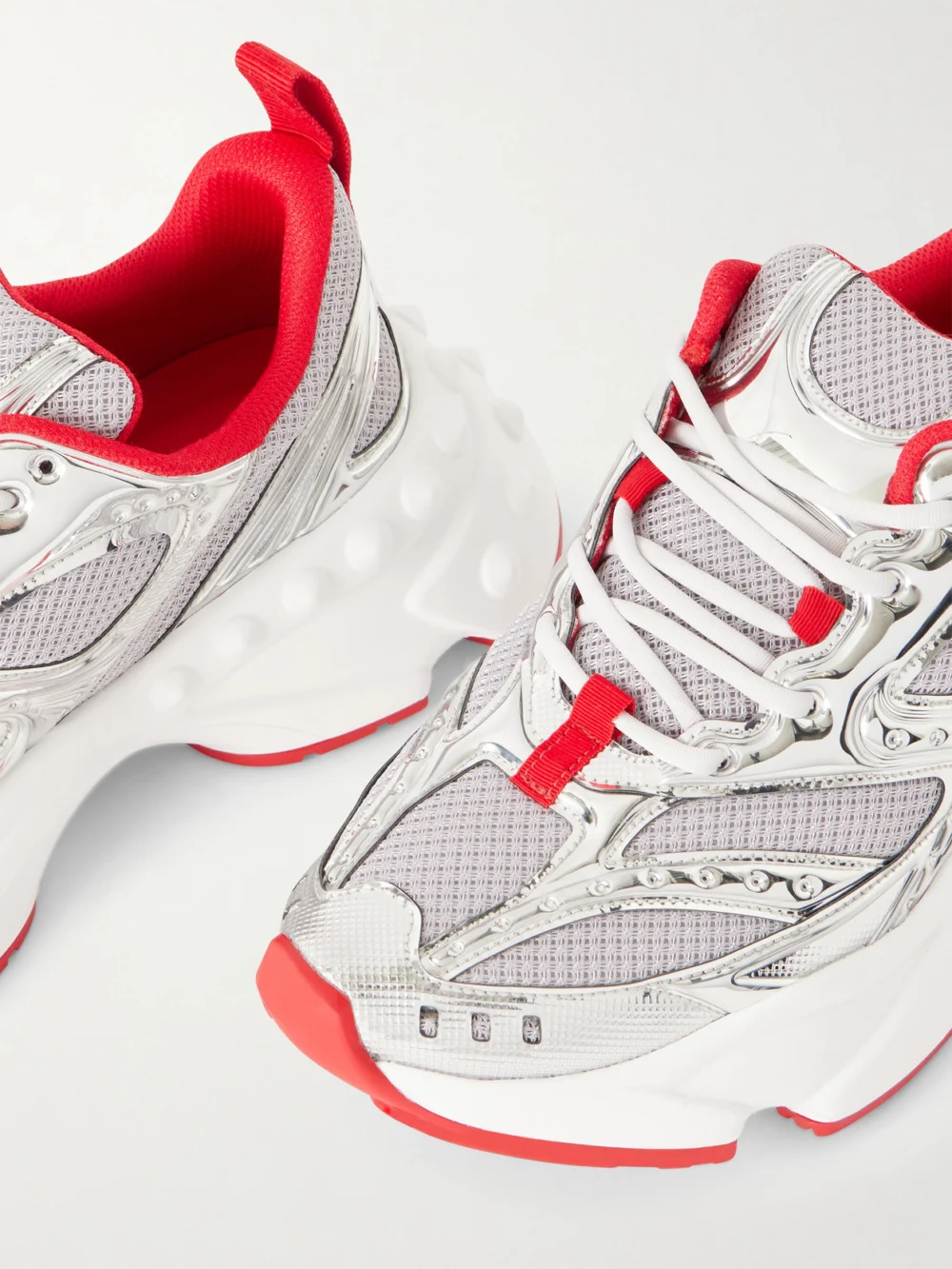Close-up detail of the Christian Louboutin So Flo Metallic Leather-trimmed Mesh Sneakers