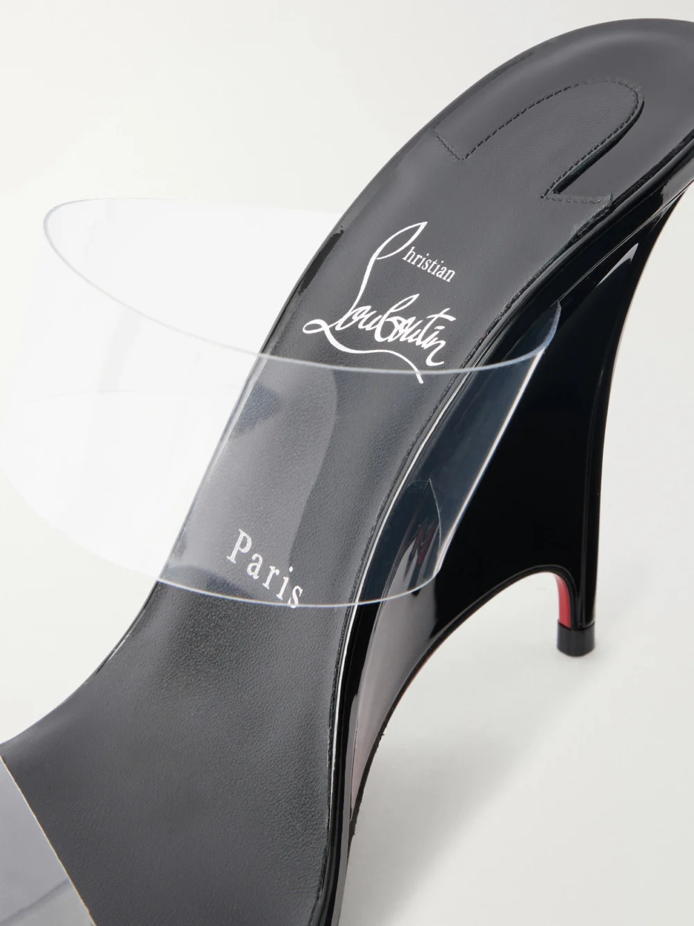 Close-up detail of the Christian Louboutin Solo Zee 100 Tpu Wedge Sandals