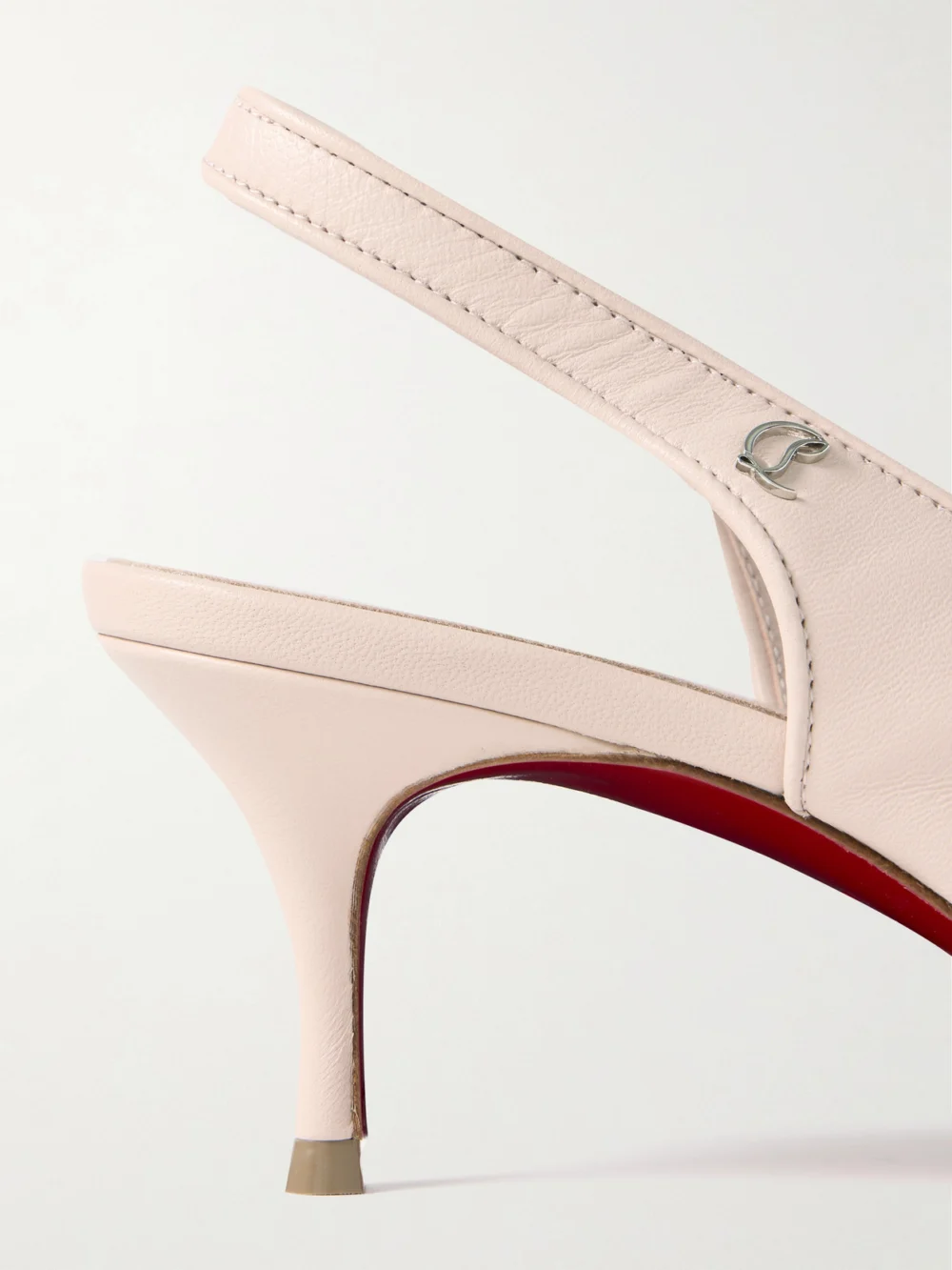 Close-up detail of the Christian Louboutin Sporty Kate 45 Leather Slingback Pumps