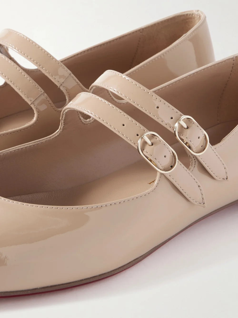 Close-up detail of the Christian Louboutin Sweet Jane Patent-leather Flats