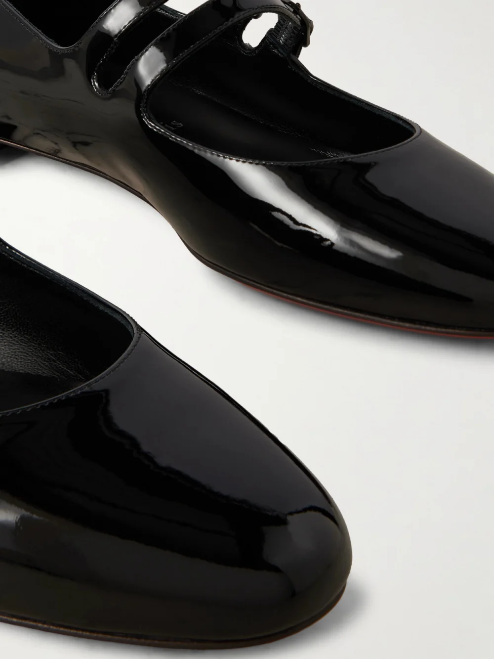 Close-up detail of the Christian Louboutin Sweet Jane Patent-leather Flats