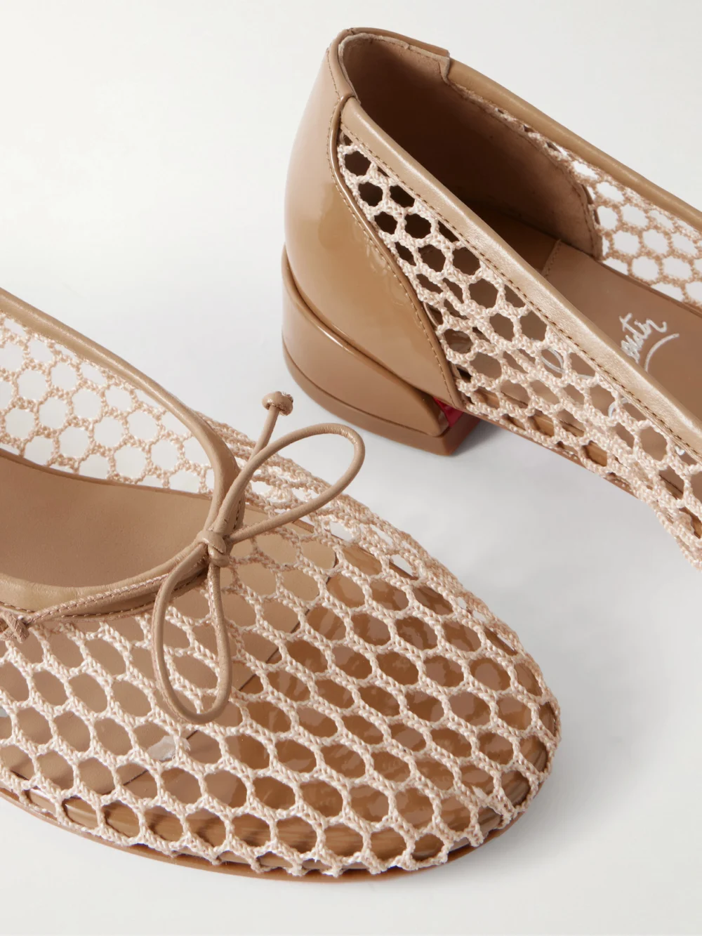 Close-up detail of the Christian Louboutin Sweetie Jane 20 Patent Leather-trimmed Crocheted Ballet Flats