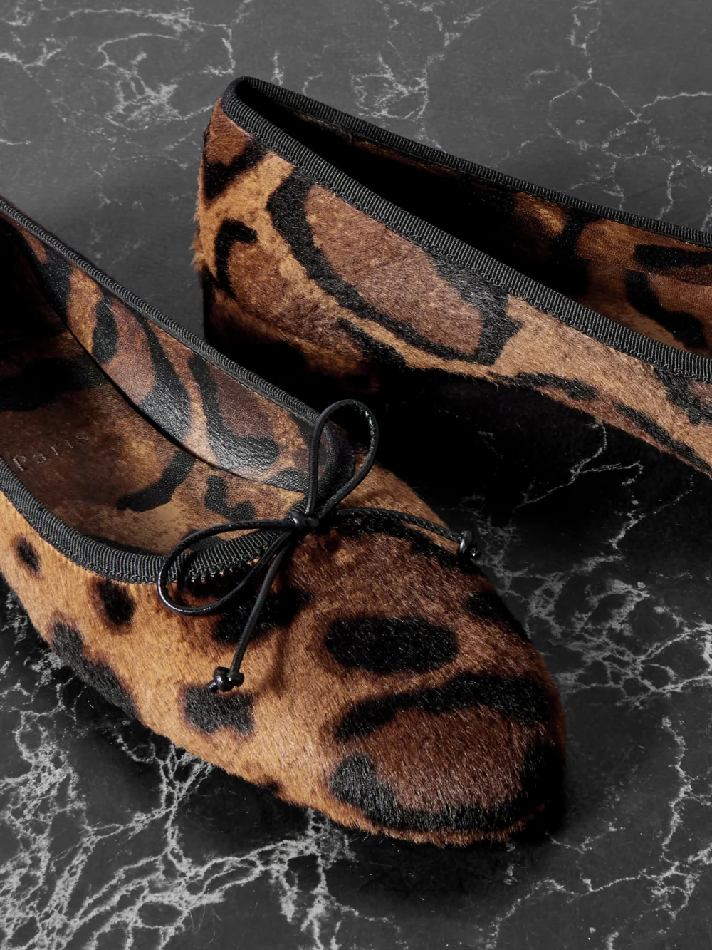 Close-up detail of the Christian Louboutin Sweetie Jane Leopard-print Calf Hair Ballet Flats
