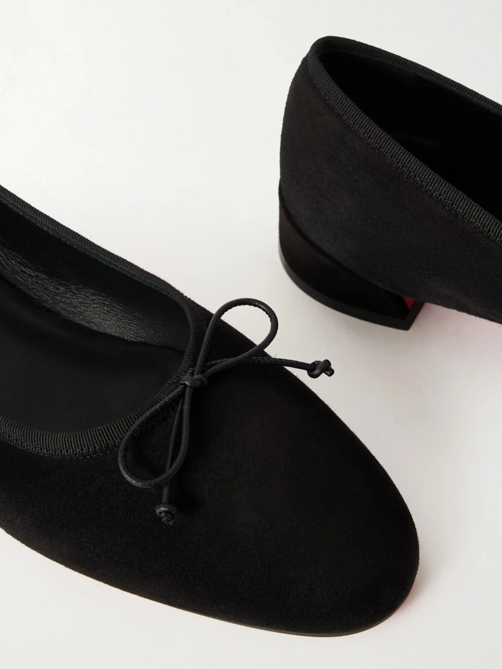 Close-up detail of the Christian Louboutin Sweetie Jane Suede Ballet Flats