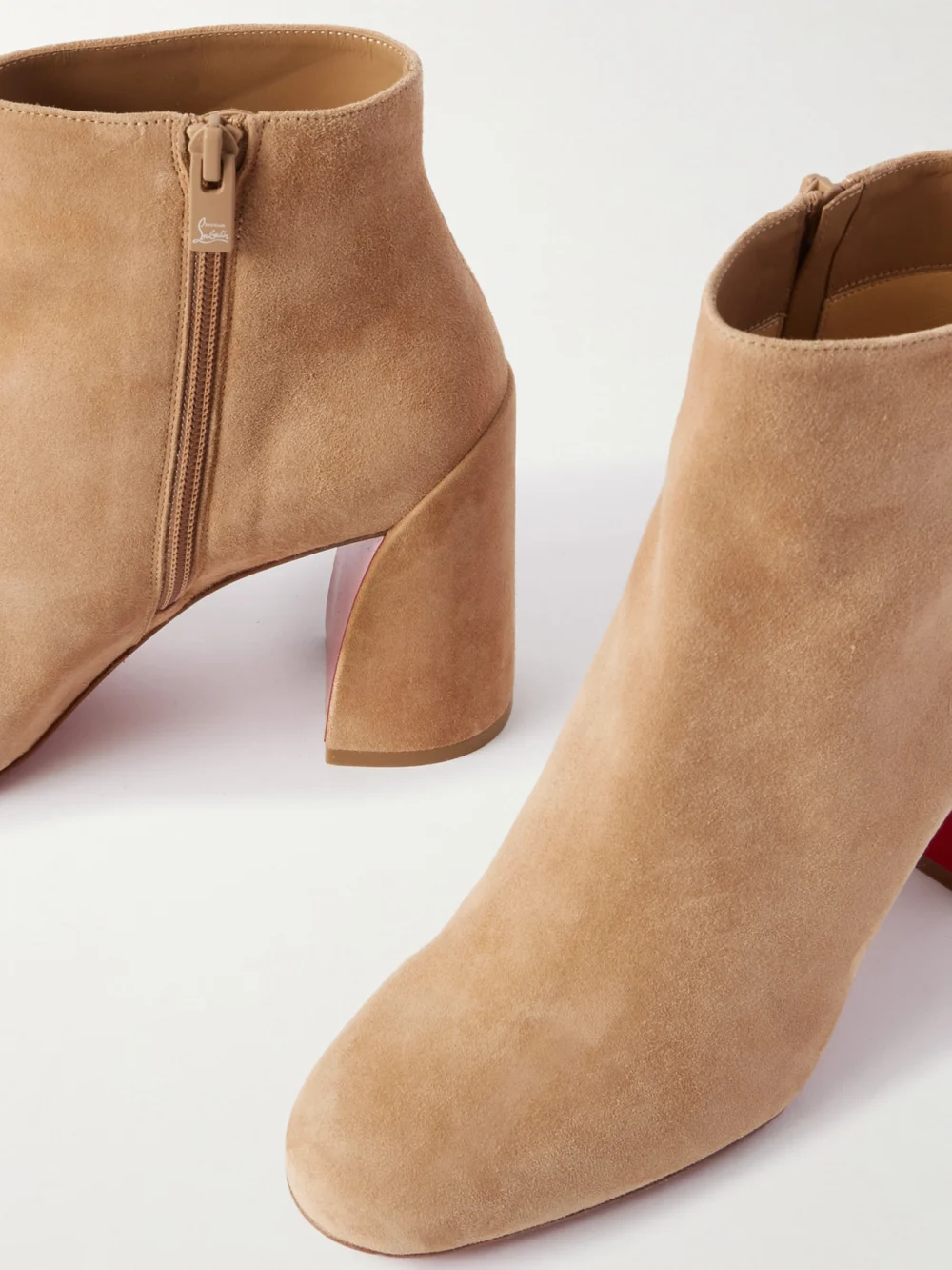 Close-up detail of the Christian Louboutin Turela 85 Suede Ankle Boots