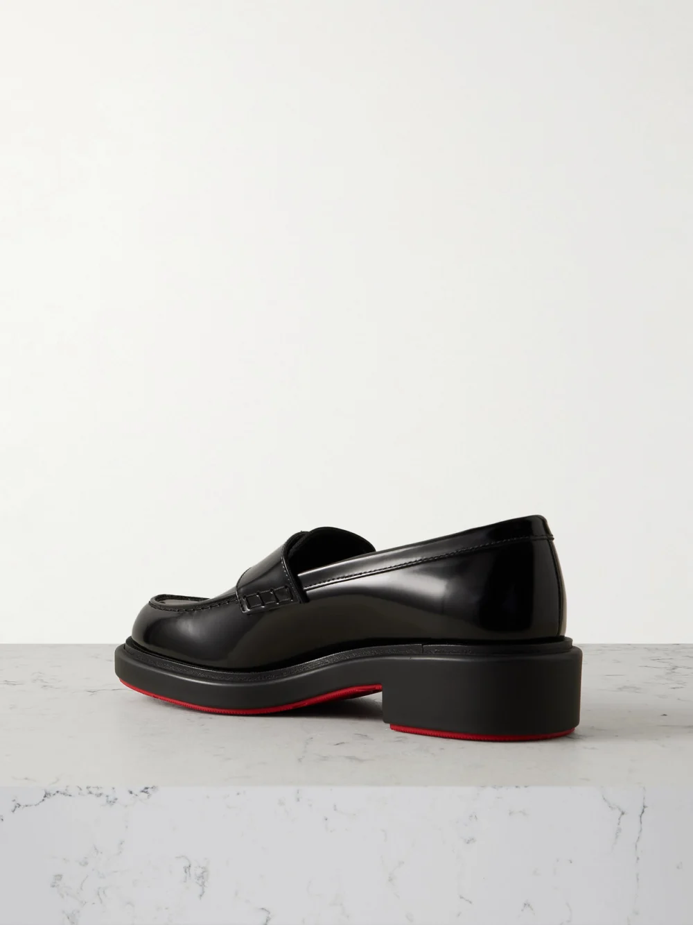 Back view of the Christian Louboutin Urban Moc Lock Embellished Glossed-leather Loafers