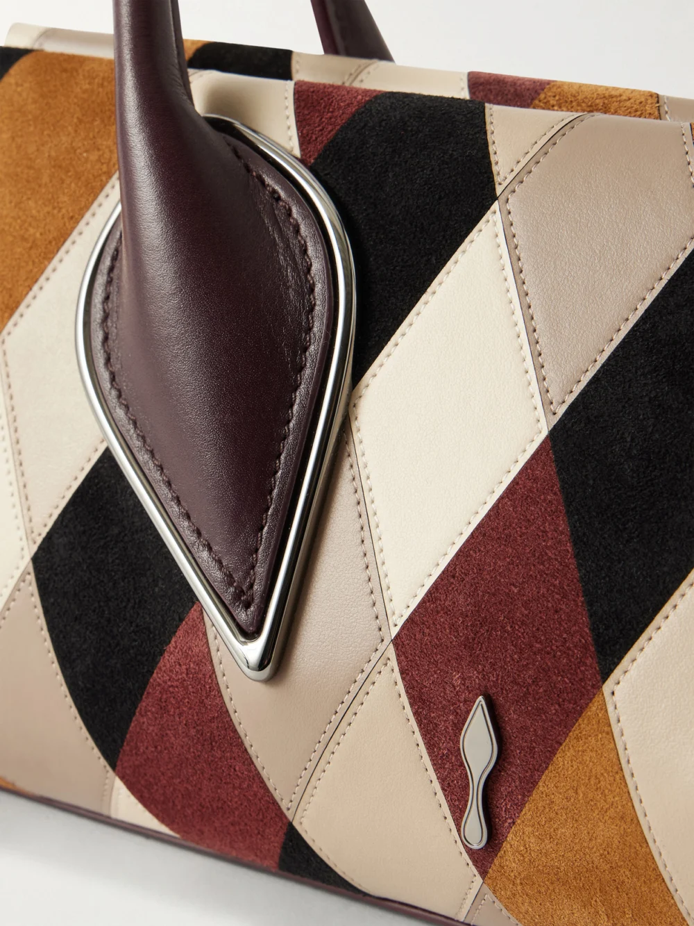 Close-up detail of the Christian Louboutin Venus Baguette Patchwork Leather and Suede Shoulder Bag
