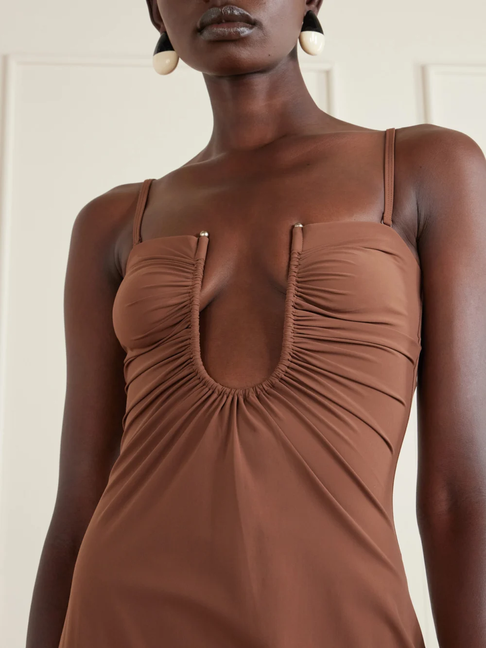 Close-up detail of the Christopher Esber Arced Ruched Satin Maxi Dress