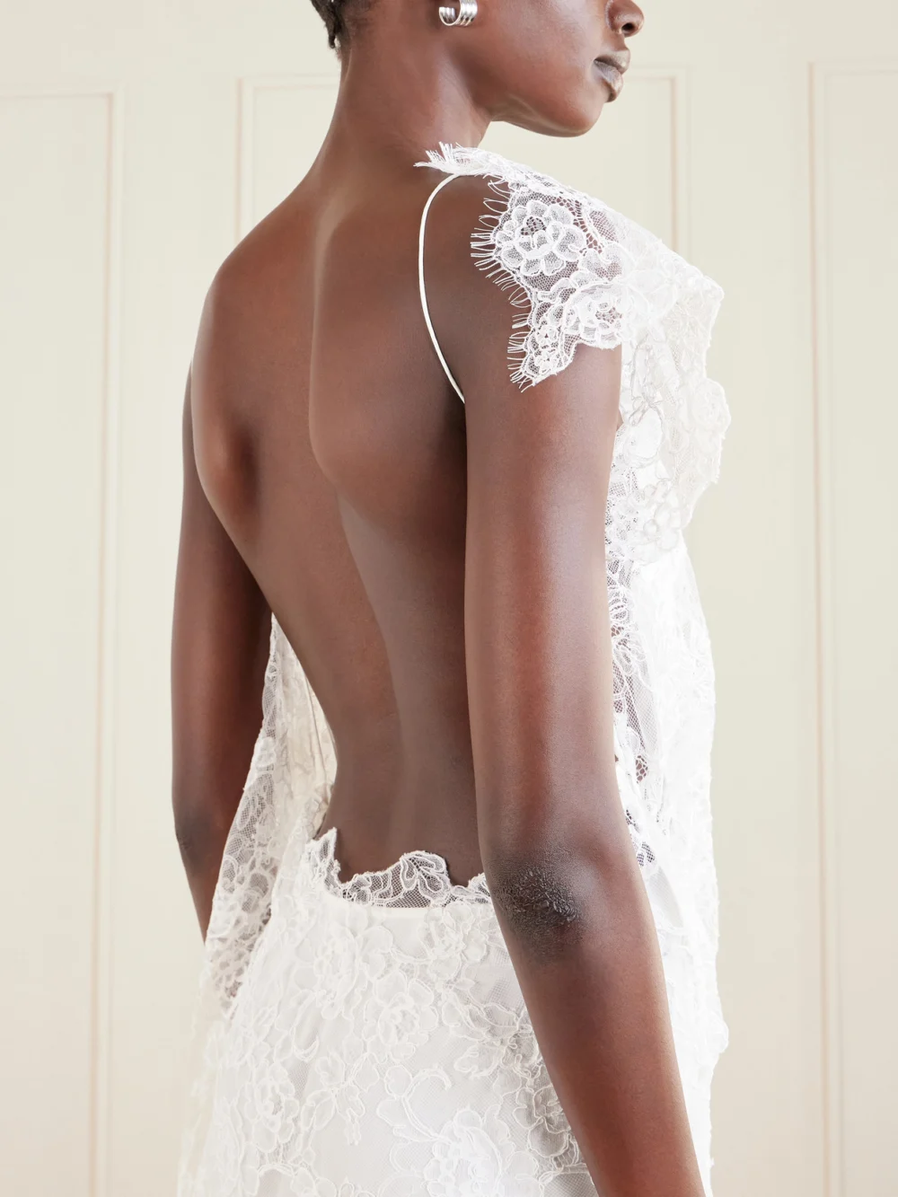 Close-up detail of the Christopher Esber Floating Backless Draped Lace Mini Dress