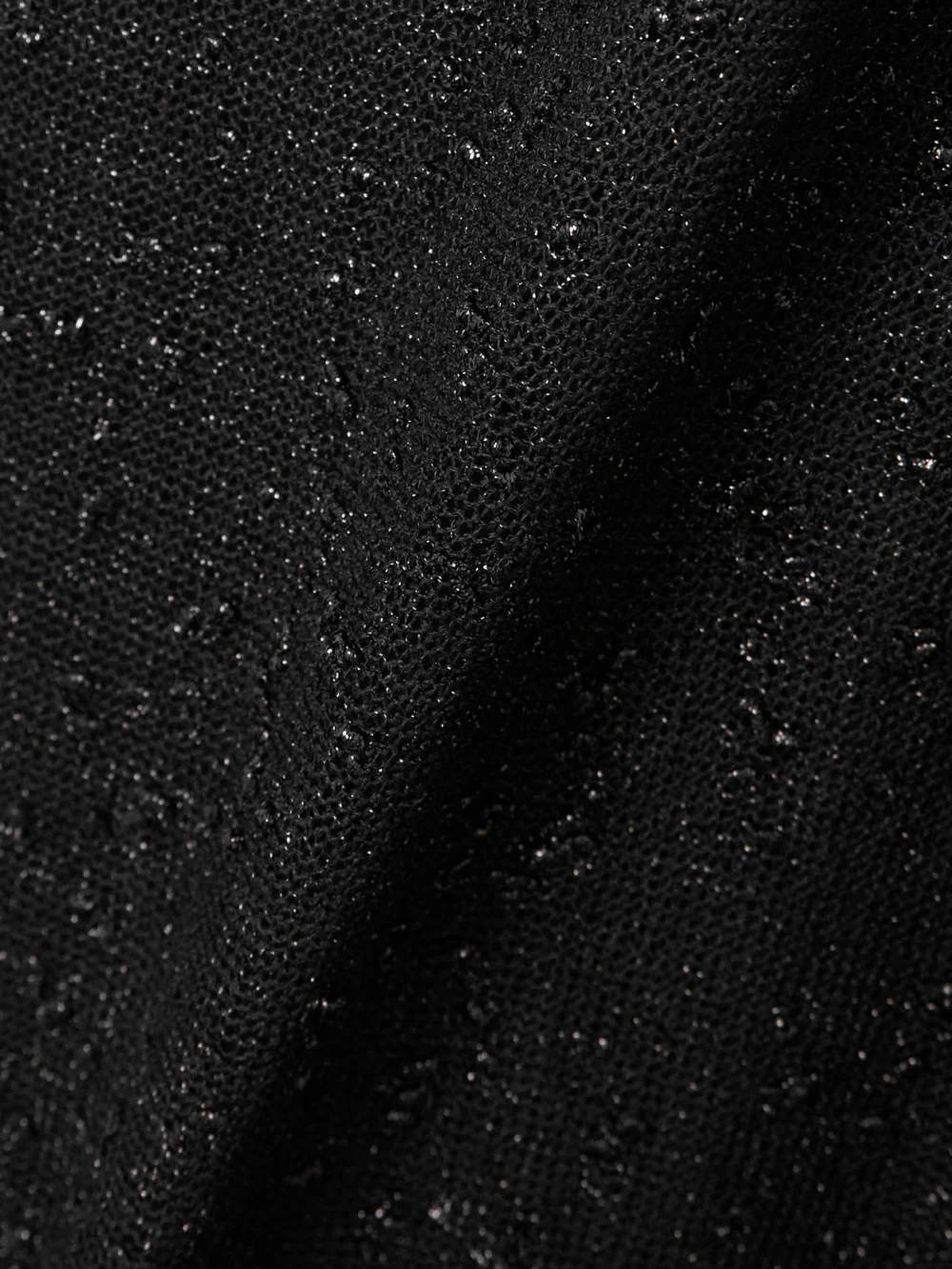 Close-up detail of the Christopher Esber Metallic Knitted Maxi Dress