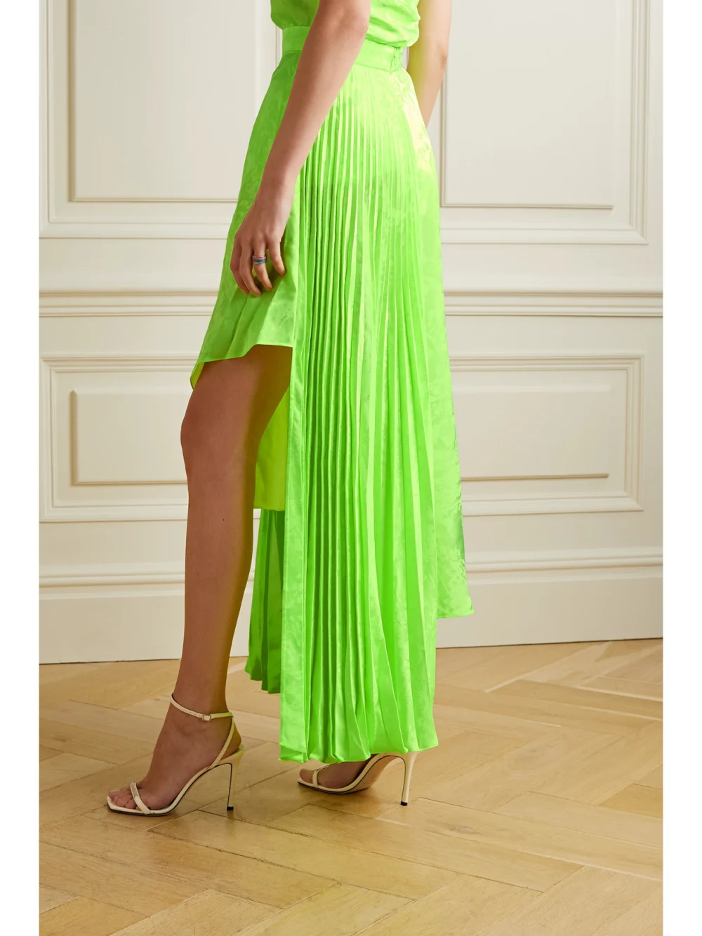 Back view of the Christopher John Rogers Asymmetric Pleated Neon Viscose Skirt