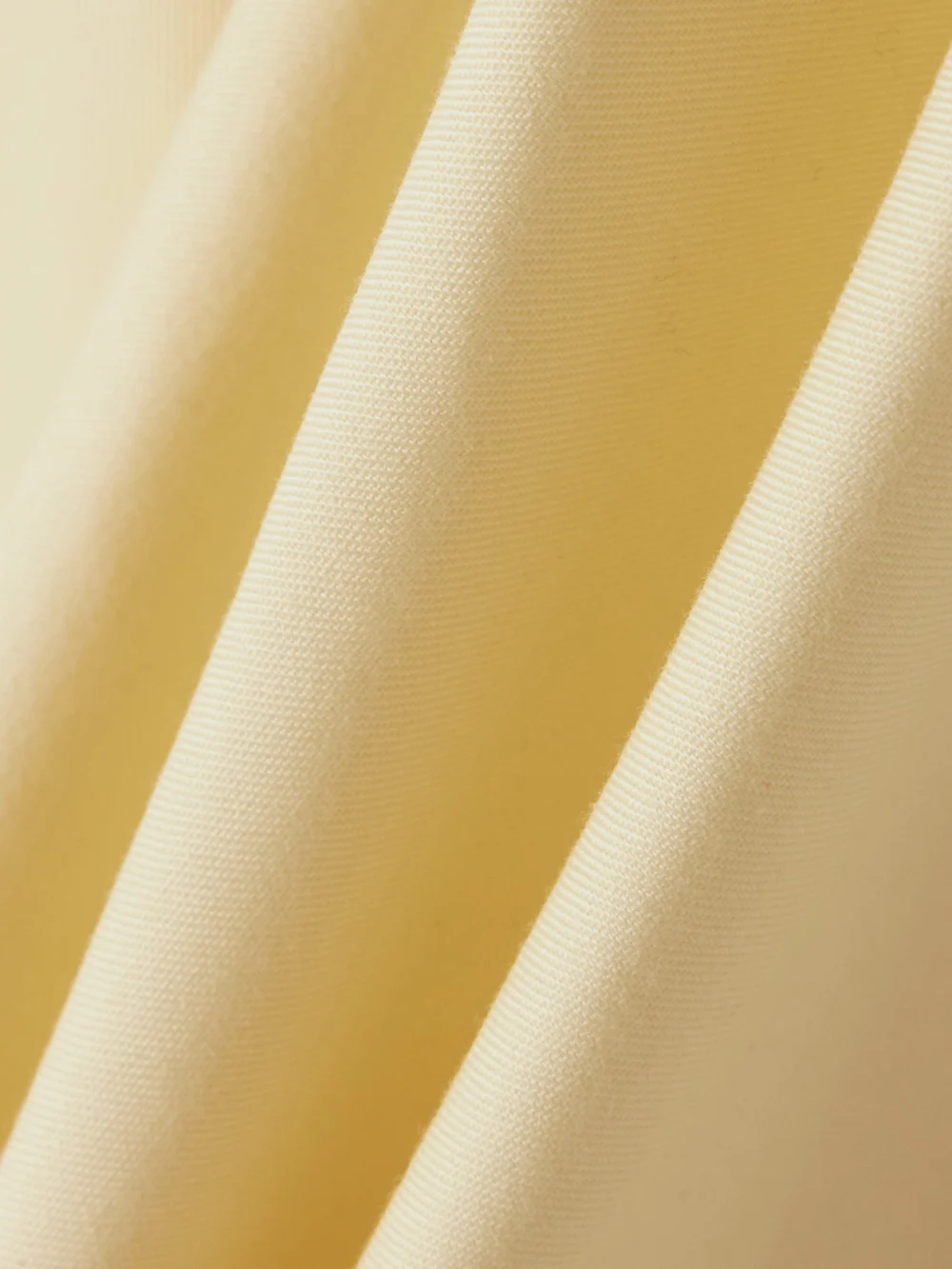 Close-up detail of the Christopher John Rogers Bow-embellished Off-the-shoulder Twill Top