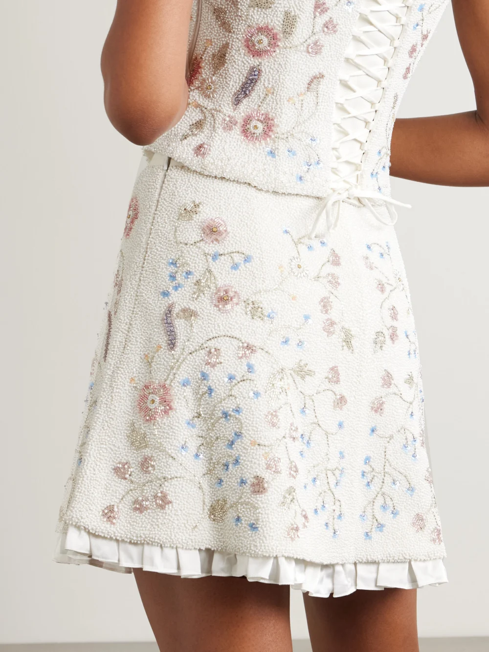Back view of the Clio Peppiatt Sophie Satin-trimmed Embellished Beaded Stretch-tulle Mini Skirt