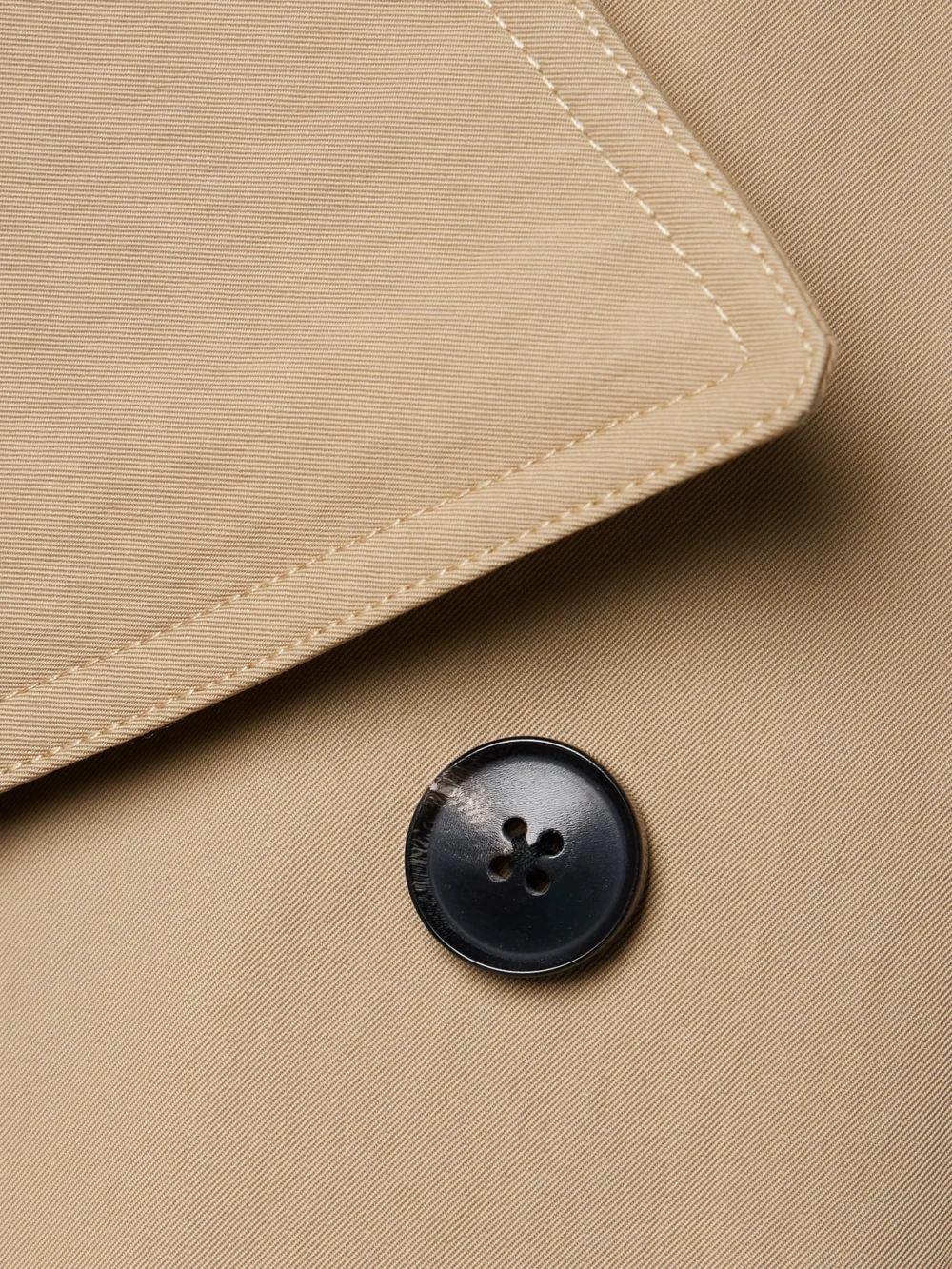 Close-up detail of the Co Belted Double-breasted Cotton-blend Twill Trench Coat