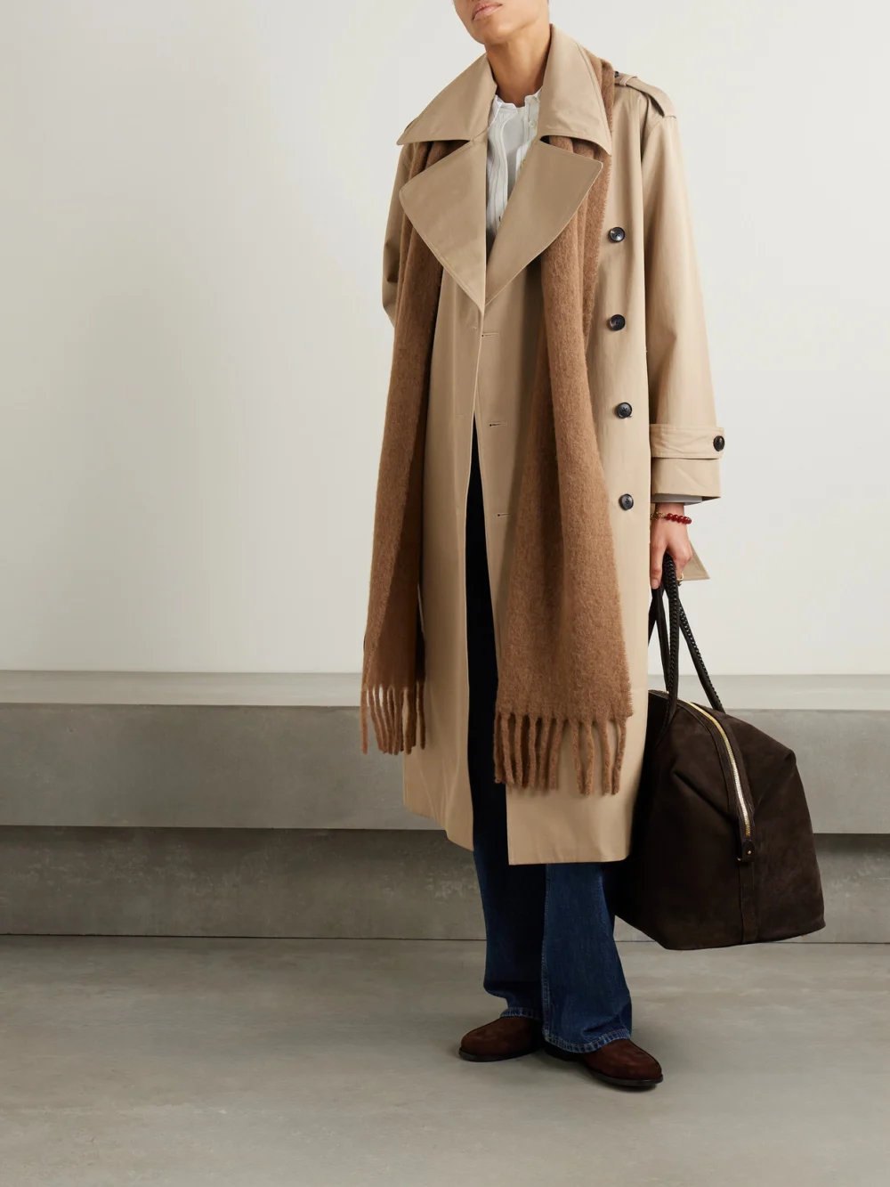Co Belted Double-breasted Cotton-blend Twill Trench Coat, worn by a model