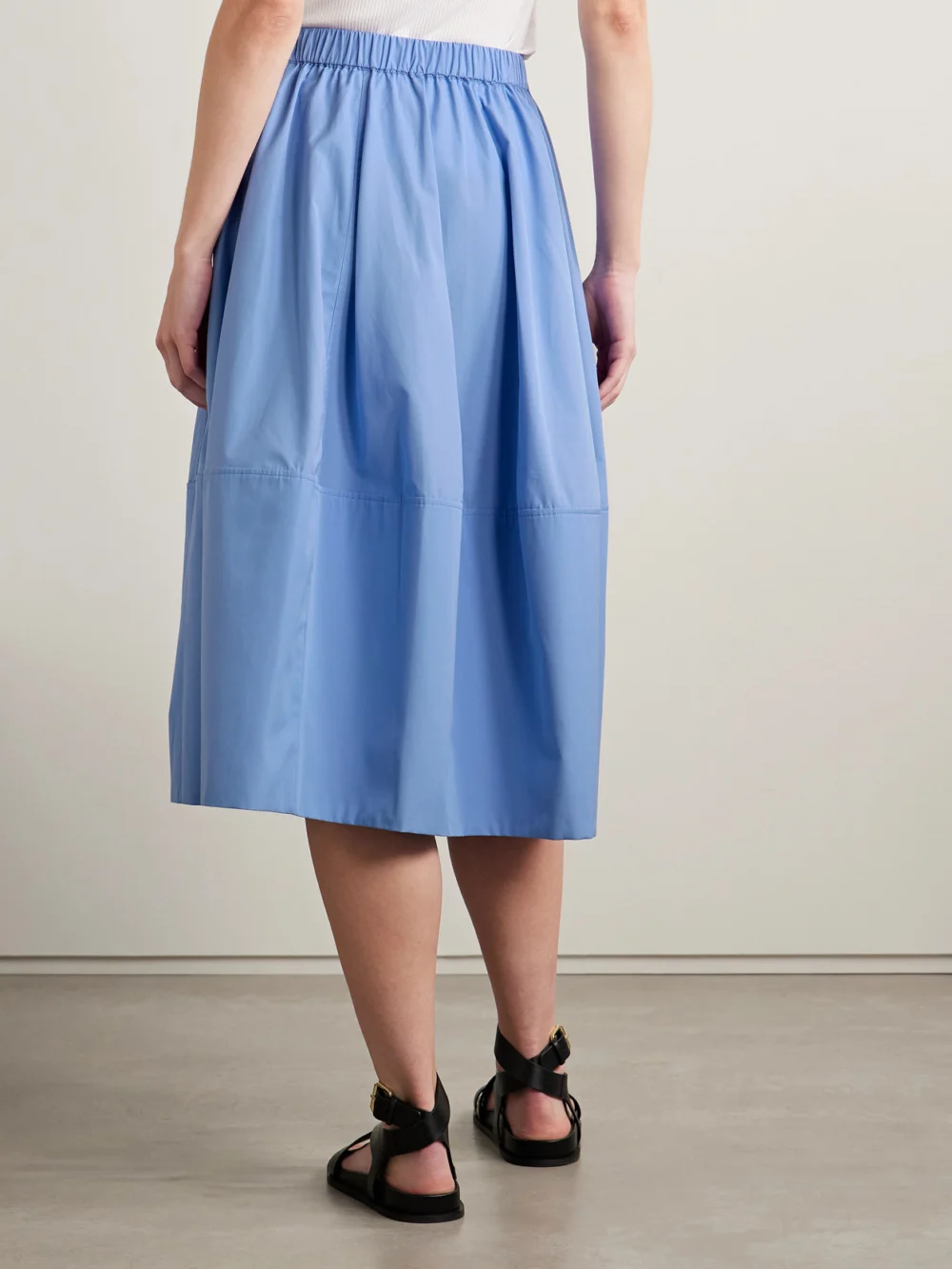 Back view of the Co Bubble Paneled Cotton-poplin Midi Skirt