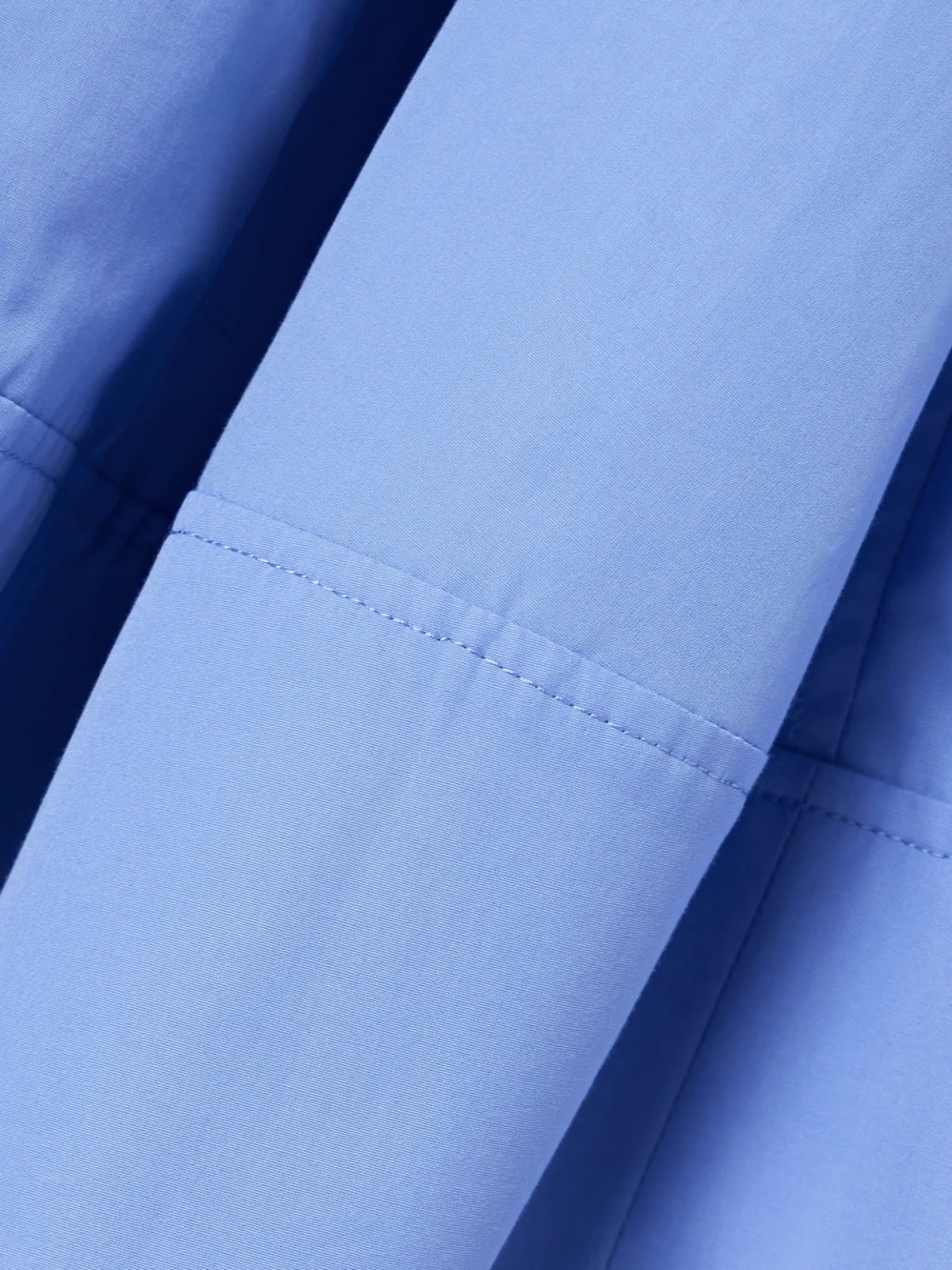 Close-up detail of the Co Bubble Paneled Cotton-poplin Midi Skirt