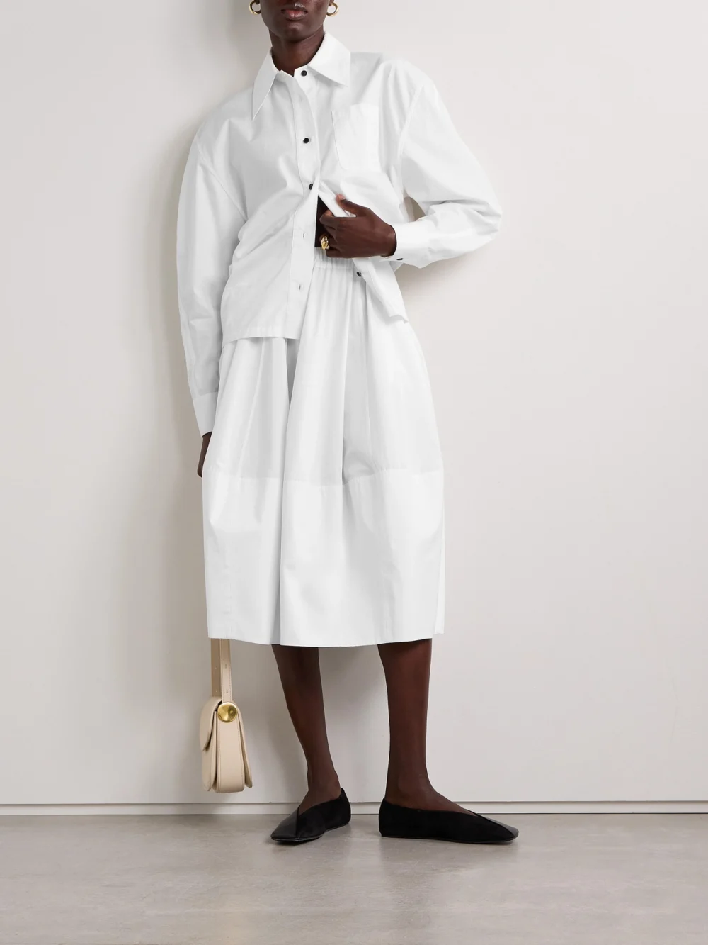 Co Bubble Paneled Cotton-poplin Midi Skirt, worn by a model