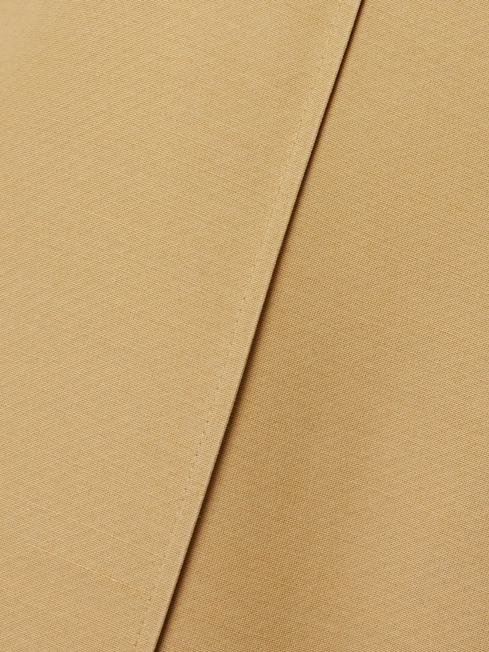 Close-up detail of the Co Cropped Woven Straight-leg Pants