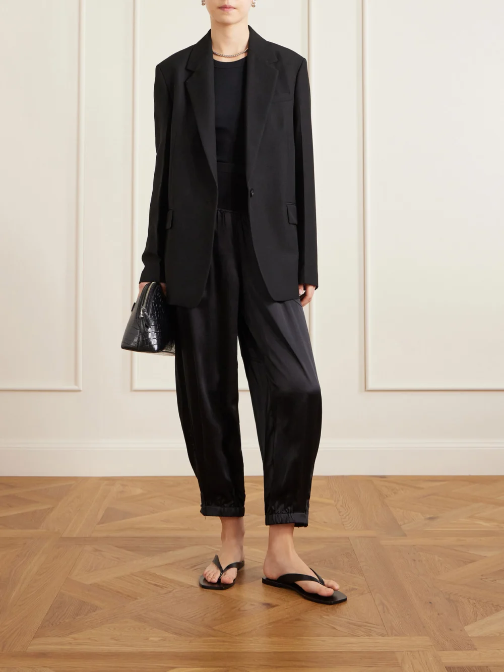 Co Cropped Zip-detailed Silk-satin Tapered Sweatpants, worn by a model