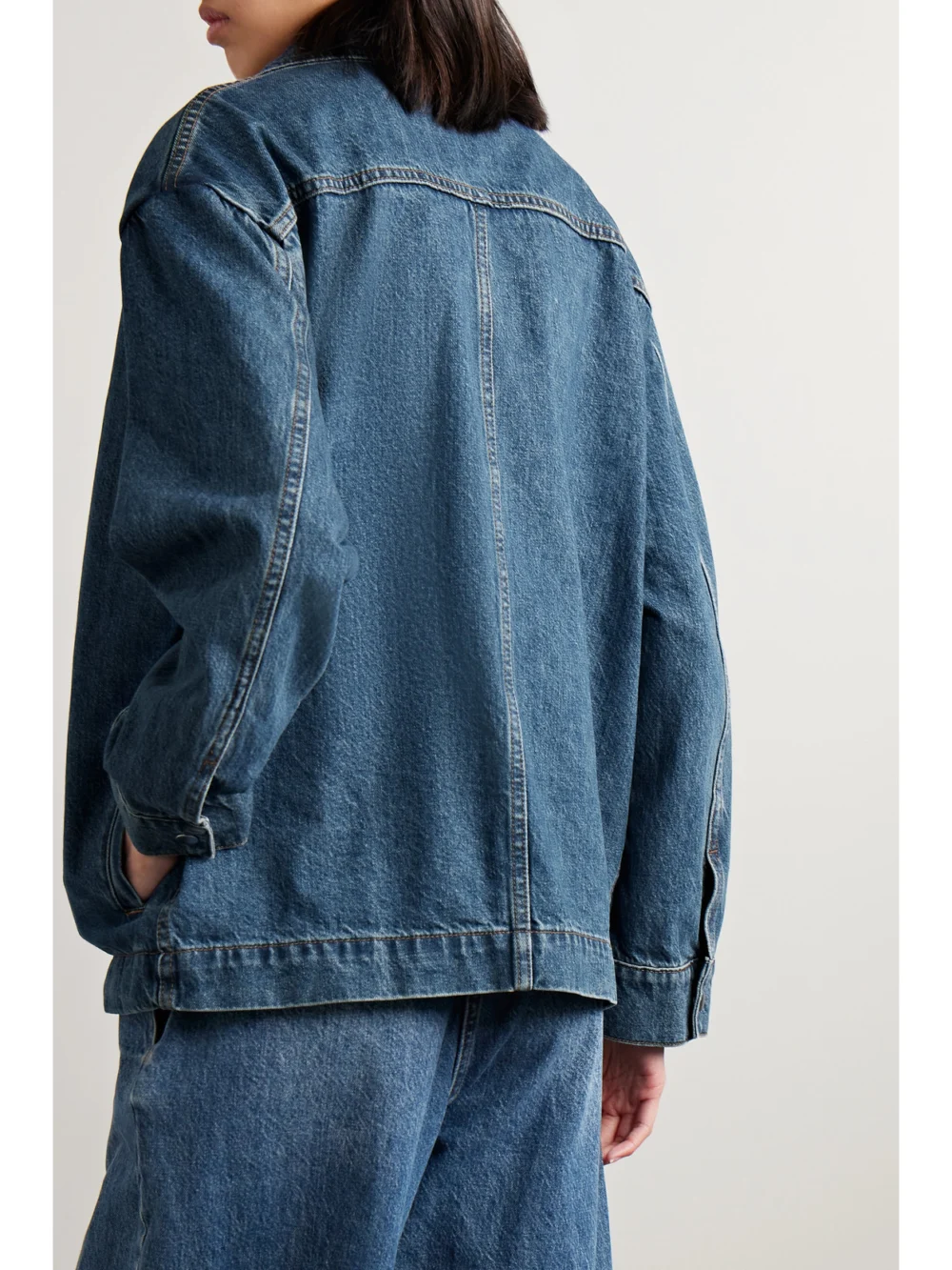 Back view of the Co Denim Bomber Jacket