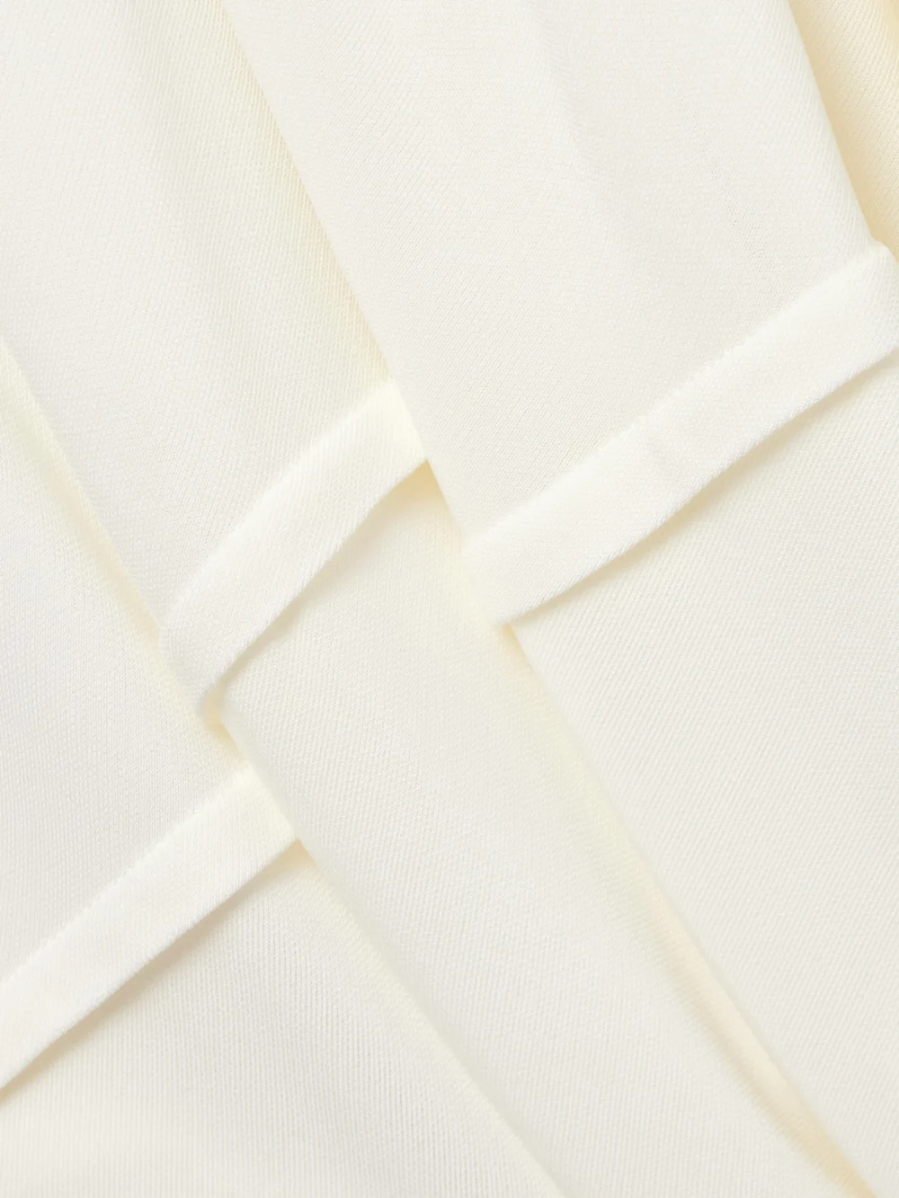 Close-up detail of the Co Draped Stretch-jersey Midi Skirt