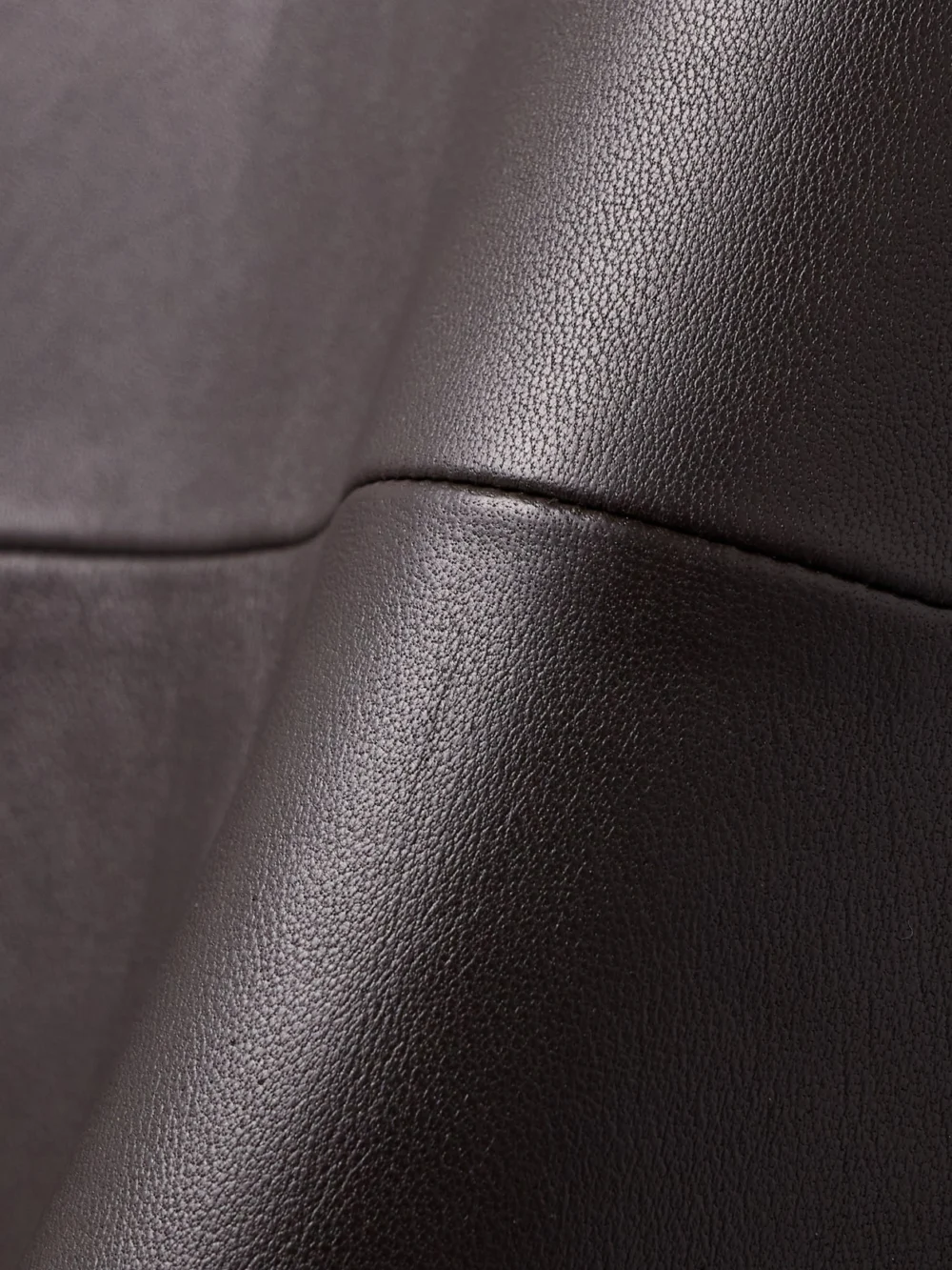 Close-up detail of the Co Paneled Leather Maxi Skirt