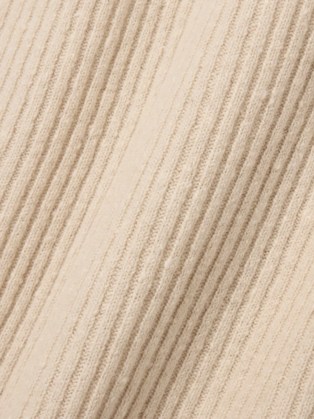 Close-up detail of the Co Ribbed Wool-blend Midi Skirt