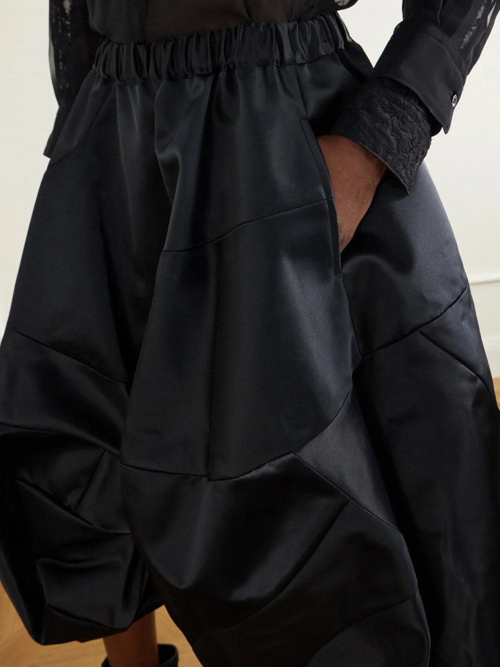 Close-up detail of the Comme des Garçons Gathered Satin Midi Skirt