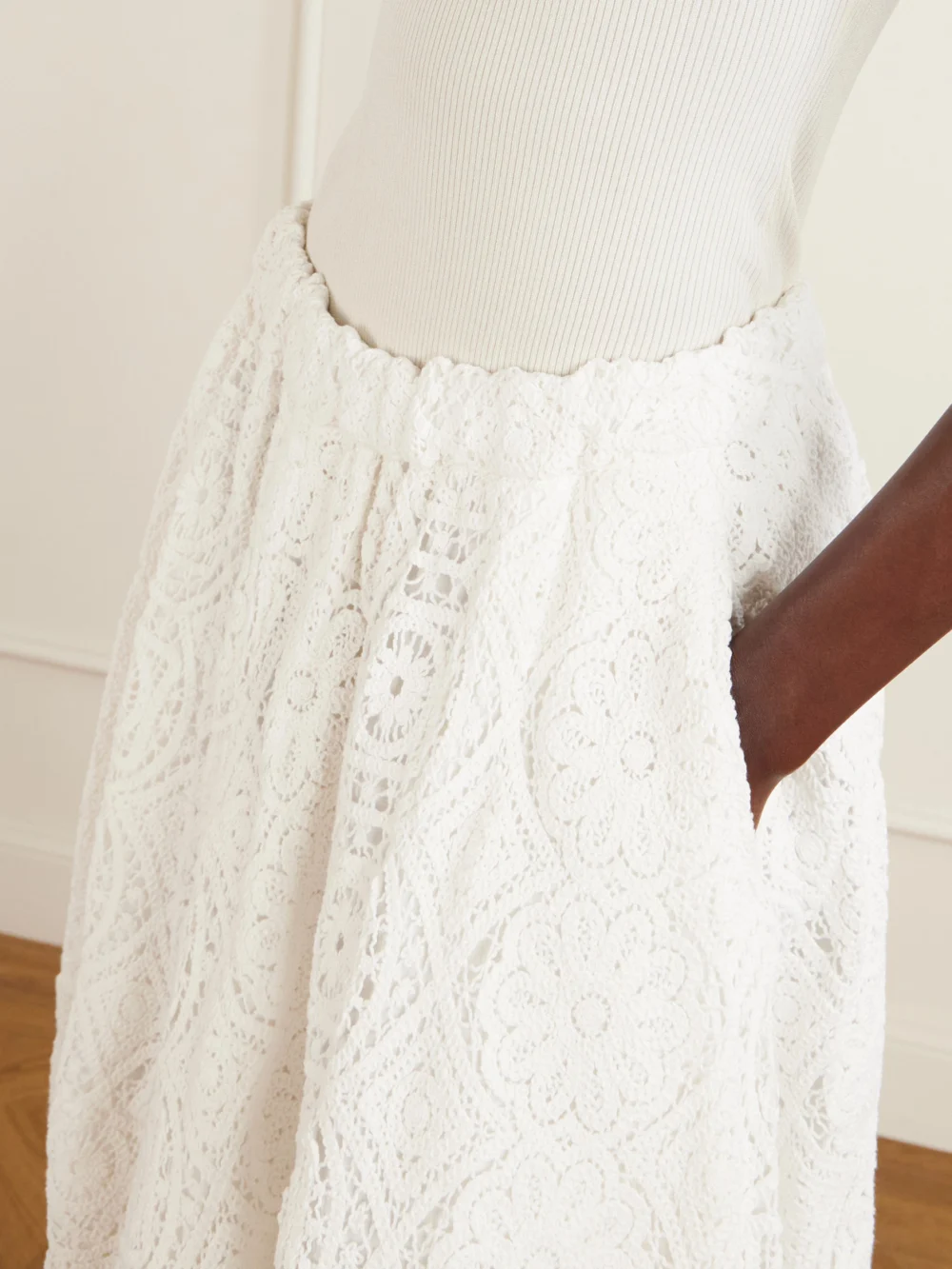 Close-up detail of the Comme des Garçons Pleated Crocheted Cotton Midi Skirt