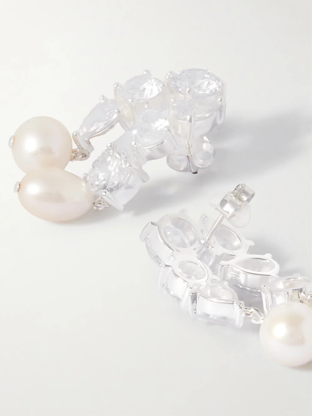 Close-up detail of the Completedworks Cascading Recycled Silver, Cubic Zirconia and Pearl Earrings