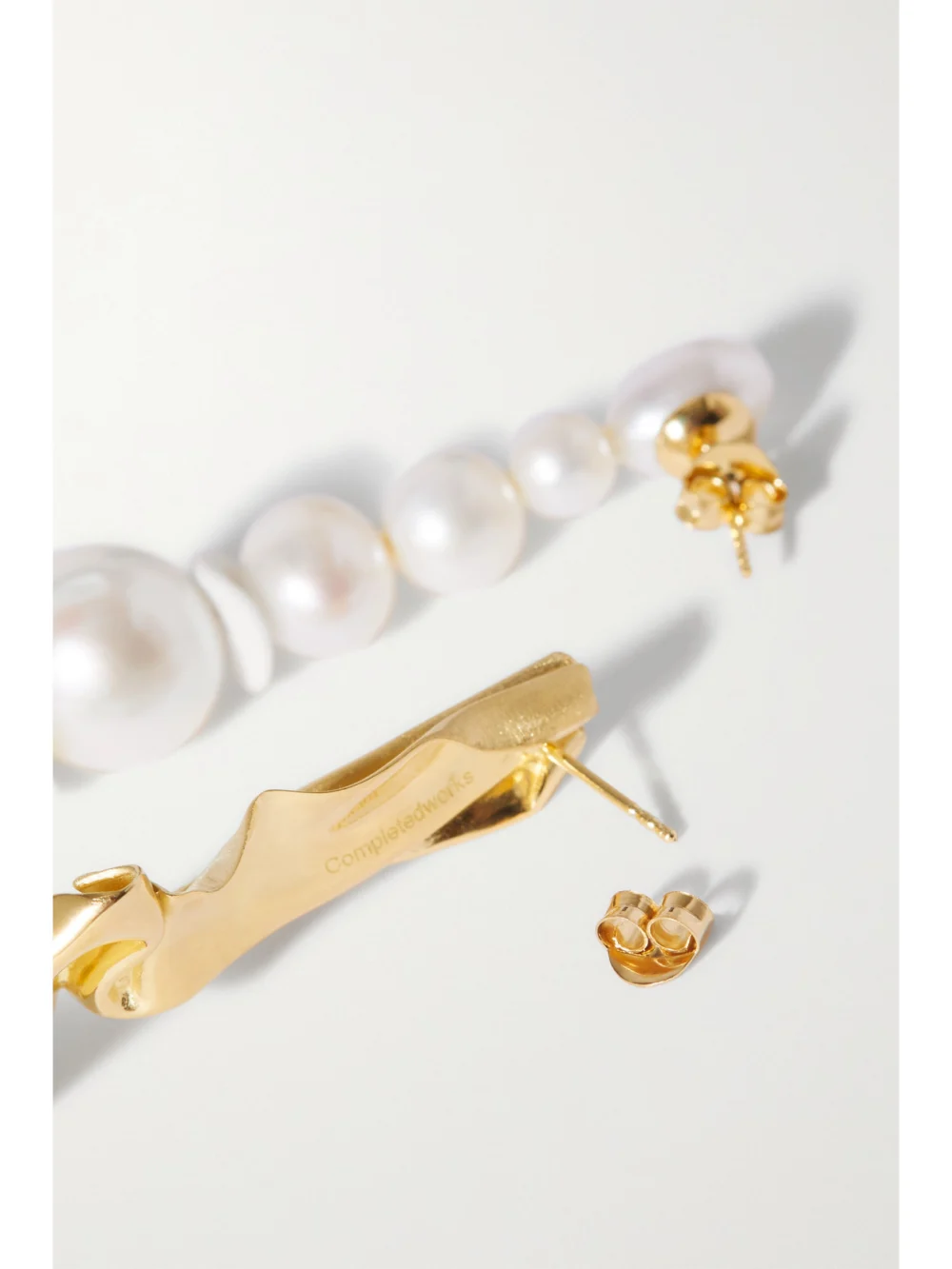 Back view of the Completedworks Crumple Gold Vermeil, Pearl and Ceramic Earrings