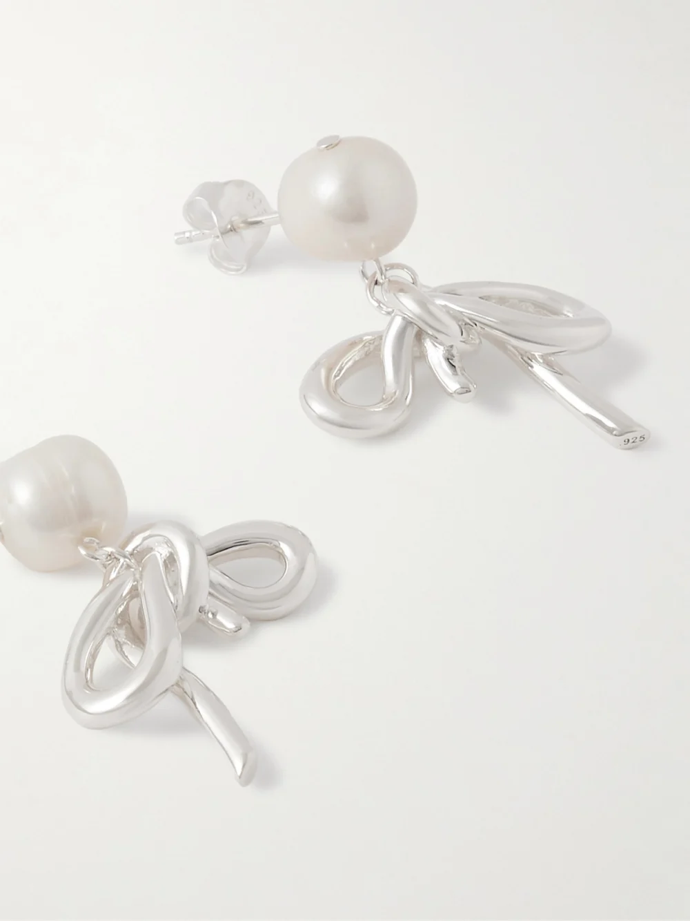 Close-up detail of the Completedworks Once in a Blue Moon Recycled Silver Pearl Earrings