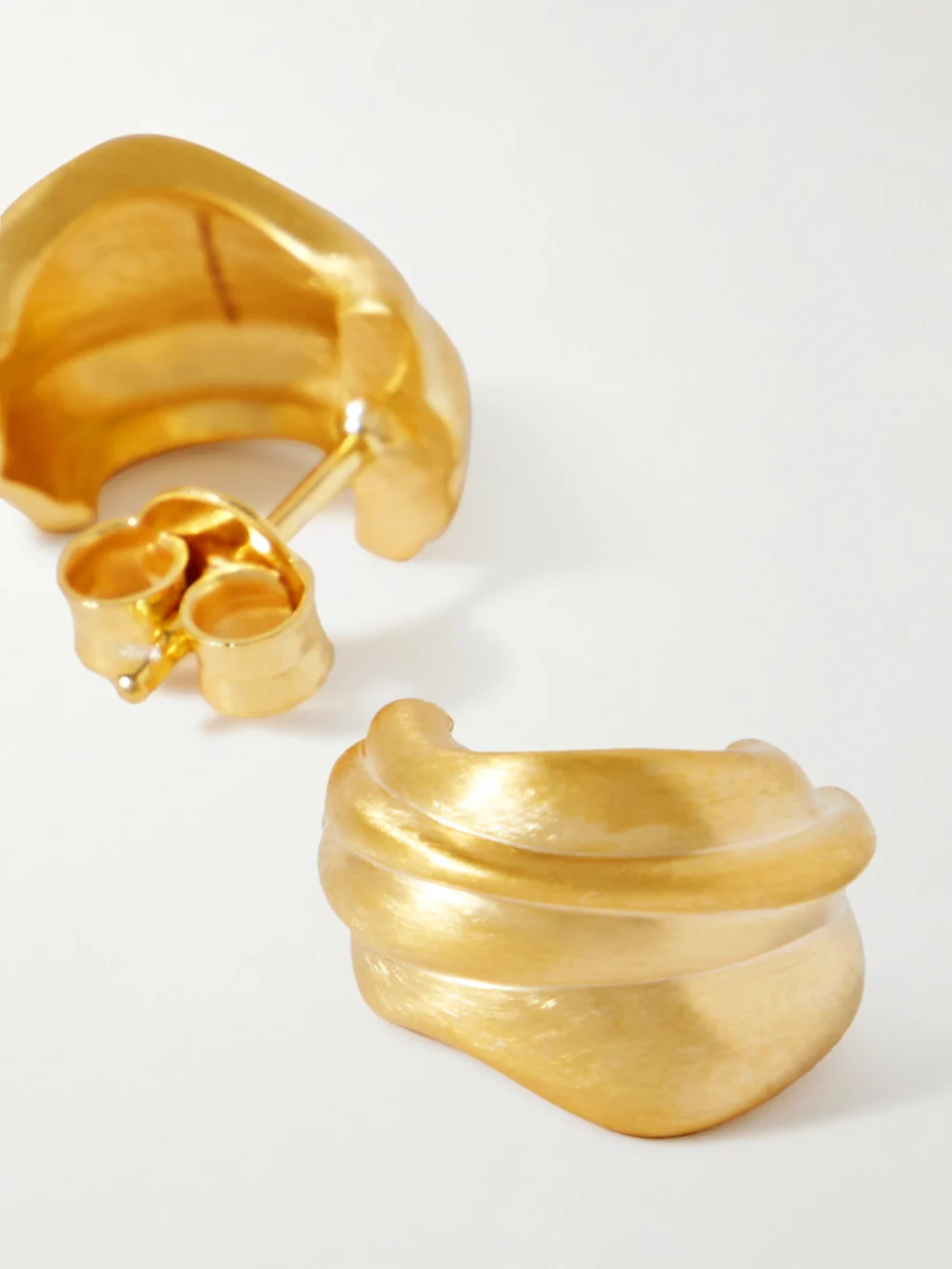 Close-up detail of the Completedworks Recycled Gold Vermeil Hoop Earrings