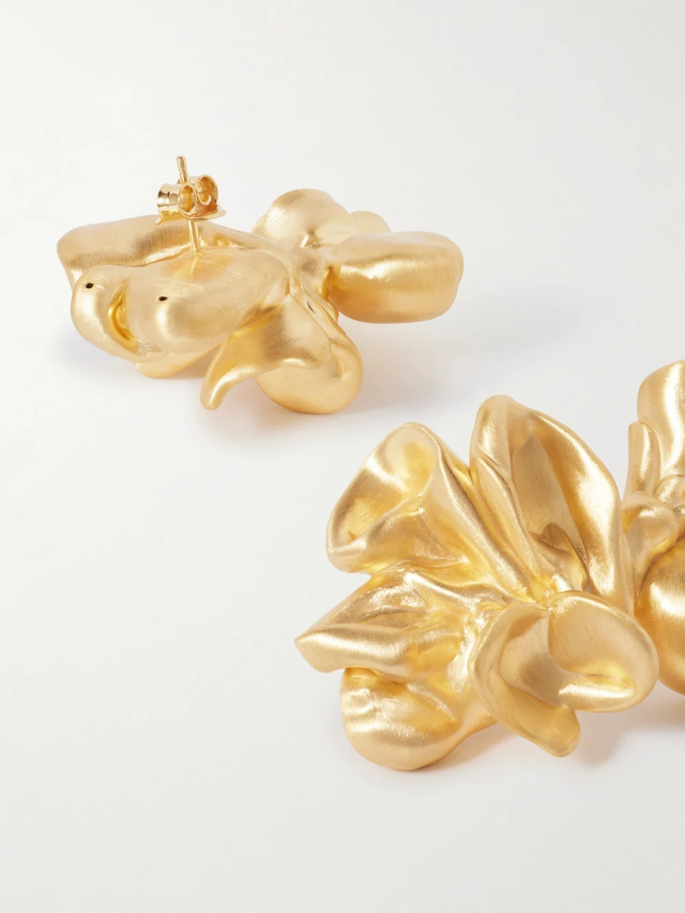 Close-up detail of the Completedworks Splotch Gold Vermeil Earrings