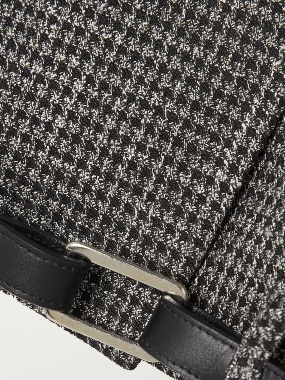Close-up detail of the Coperni Belted Cropped Checked Metallic Tweed Jacket