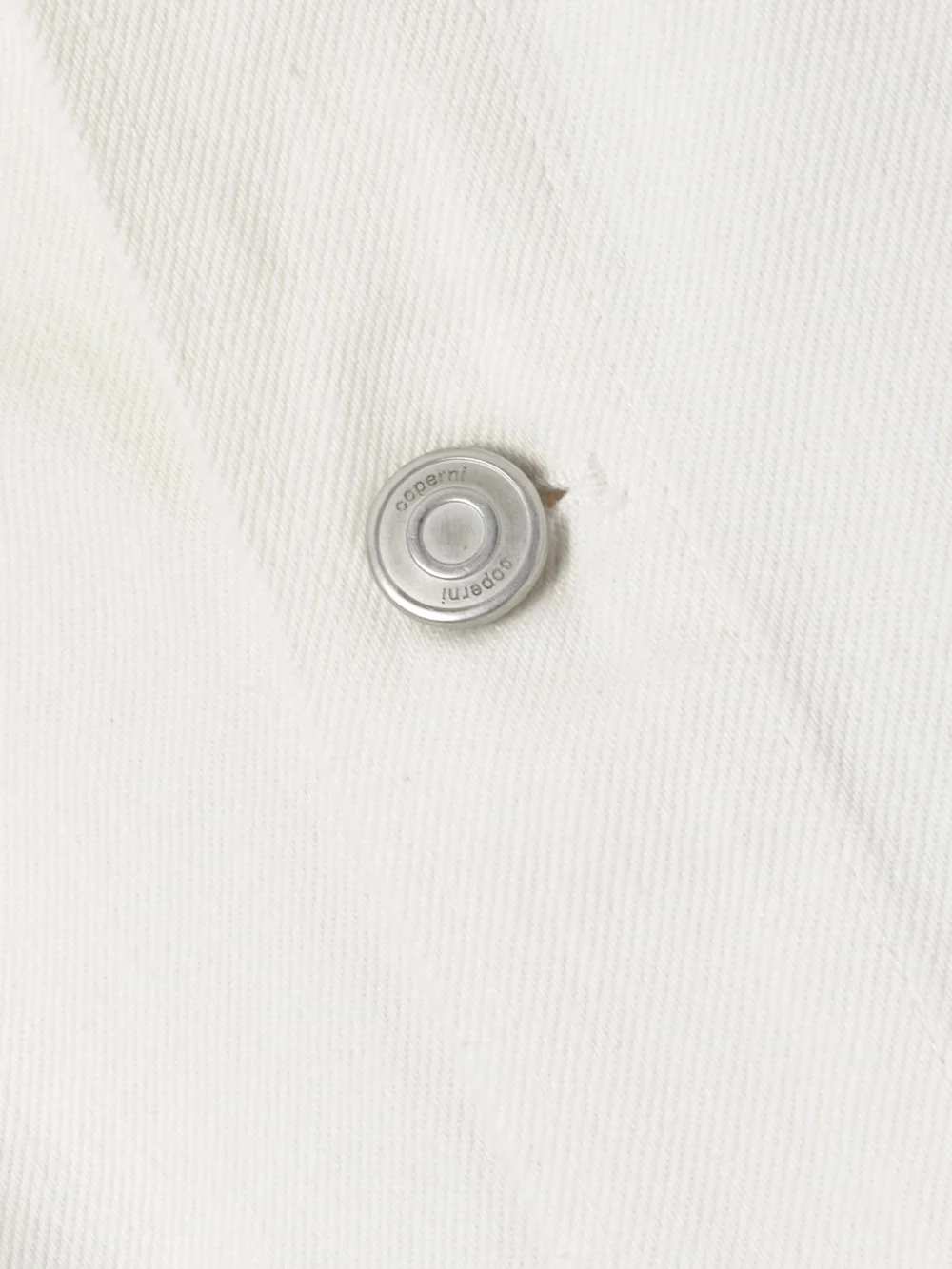 Close-up detail of the Coperni Oversized Leather-trimmed Paneled Denim Jacket