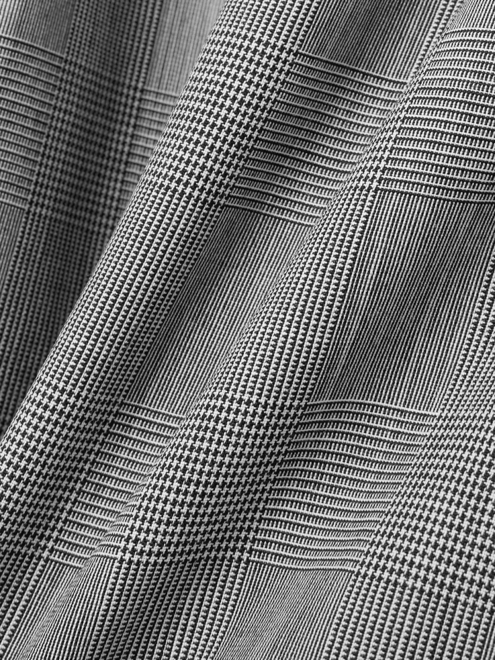 Close-up detail of the Coperni Prince of Wales Checked Wool Maxi Skirt
