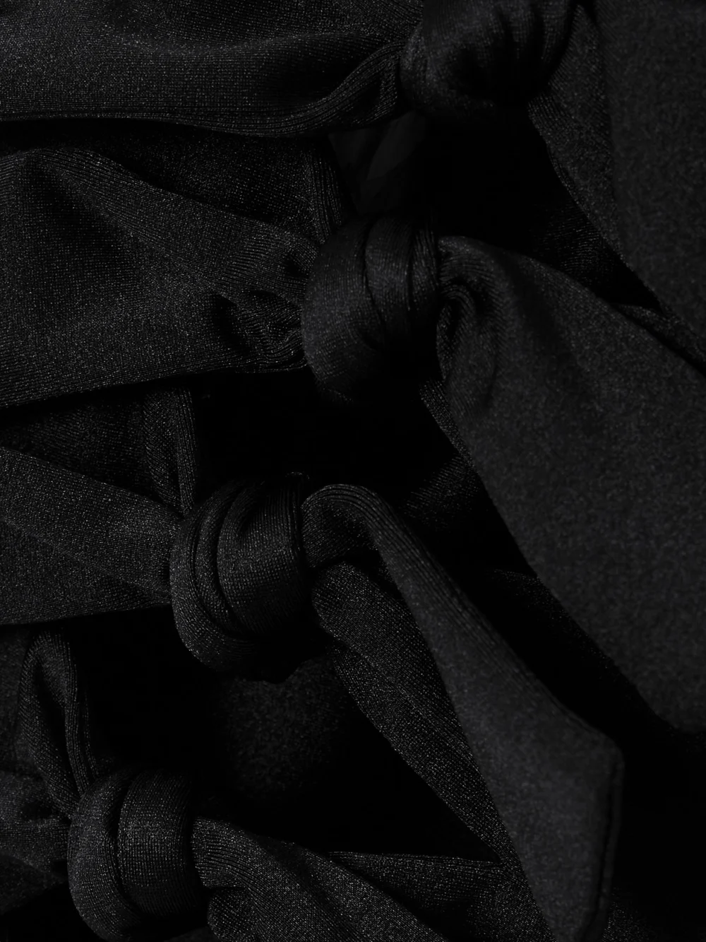 Close-up detail of the Coperni Strapless Knotted Cutout Stretch-jersey Top