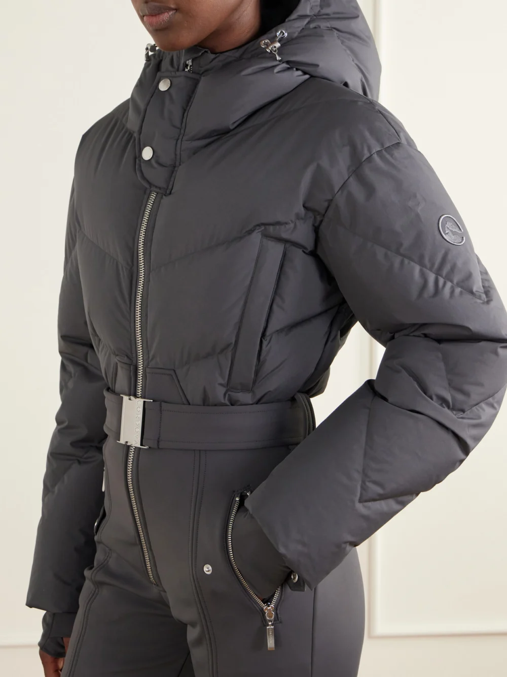 Close-up detail of the Cordova Ajax Belted Quilted Down Ski Suit
