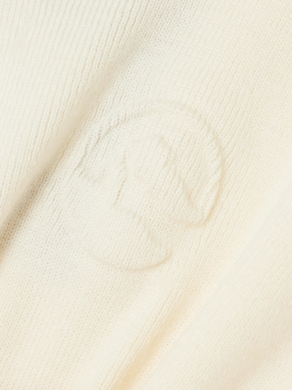 Close-up detail of the Cordova Kitz Ruffled Ribbed Merino Wool-blend Turtleneck Sweater