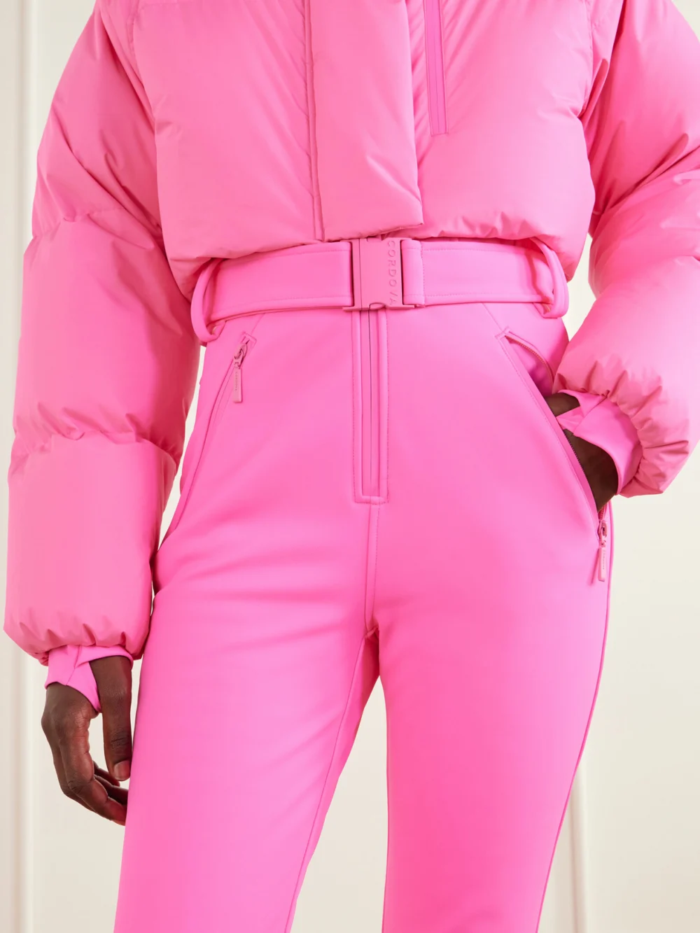 Close-up detail of the Cordova Myoko Belted Quilted Down Ski Suit