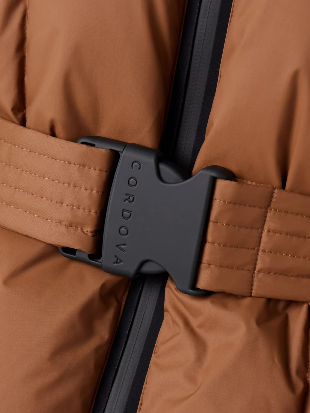 Close-up detail of the Cordova The Monterosa Hooded Belted Quilted Recycled Down Ski Jacket