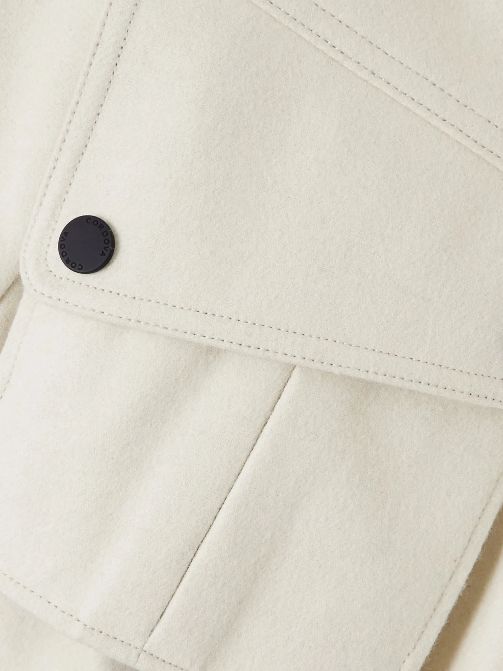 Close-up detail of the Cordova The Telluride Belted Two-tone Wool-blend and Twill Ski Suit