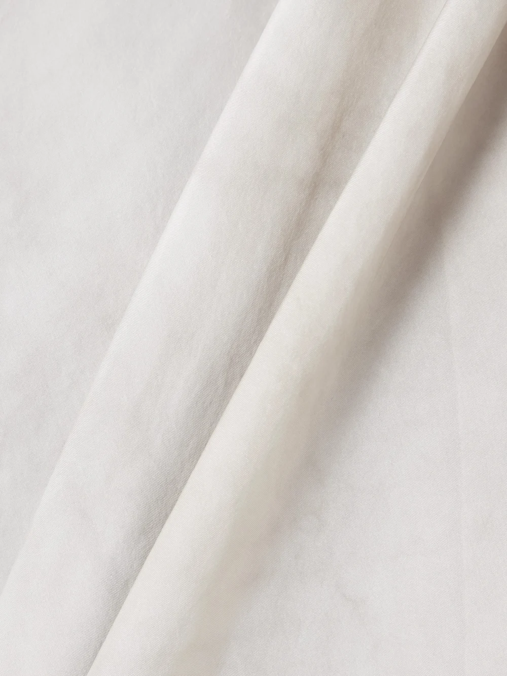 Close-up detail of the Cortana Dali Asymmetric Paneled Silk Maxi Skirt